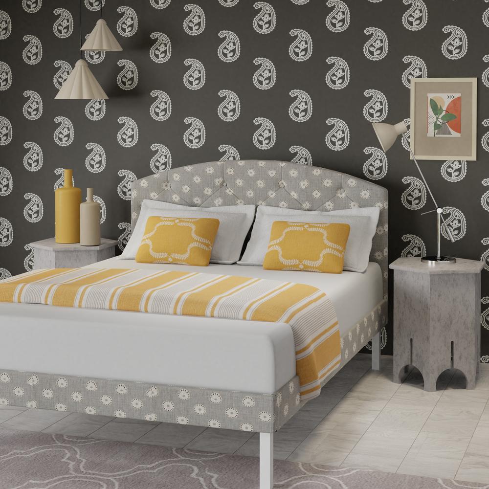 Okawa upholstered bed in grey with yellow pillows