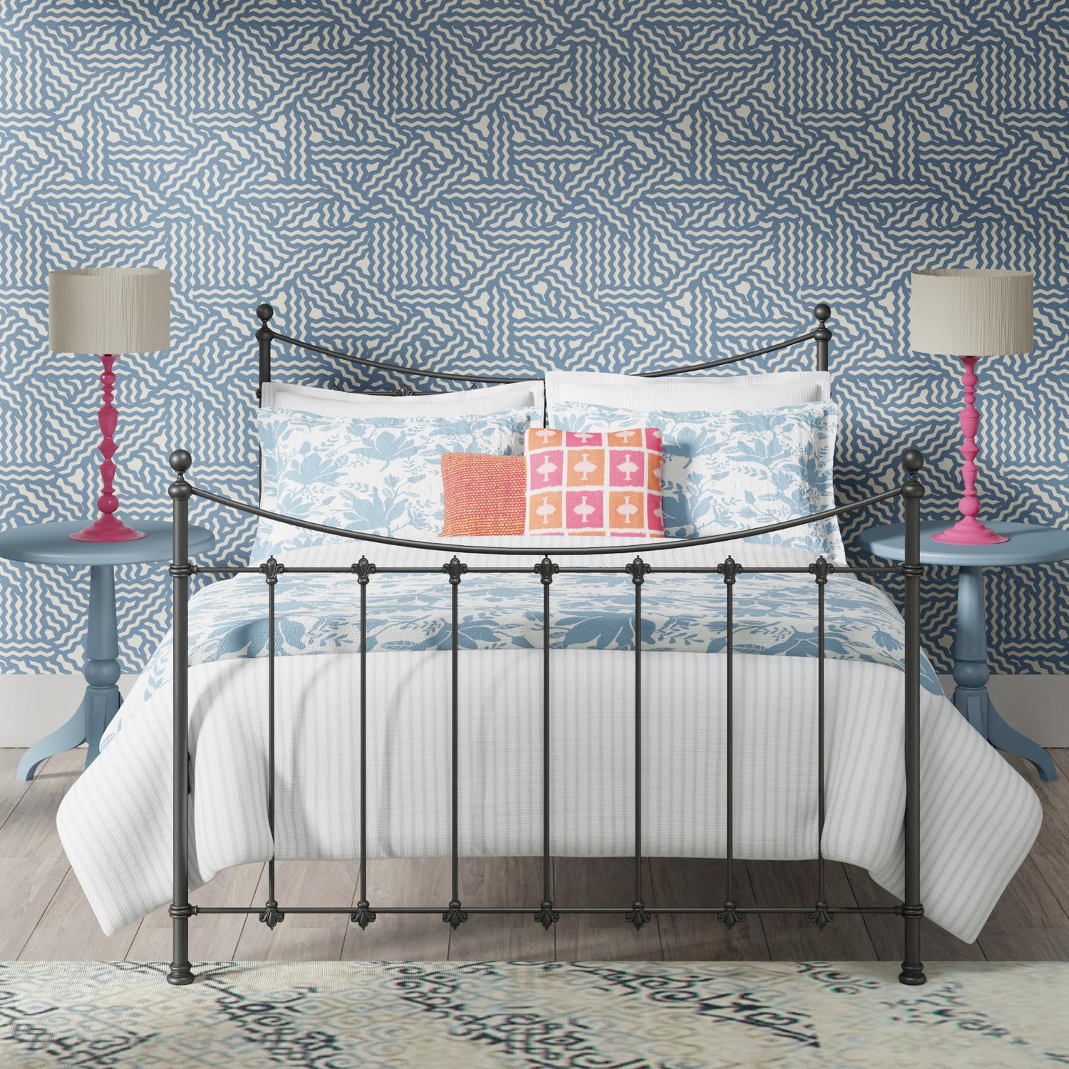 Chatsworth iron bed - Black iron bed in a blue and pink bedroom